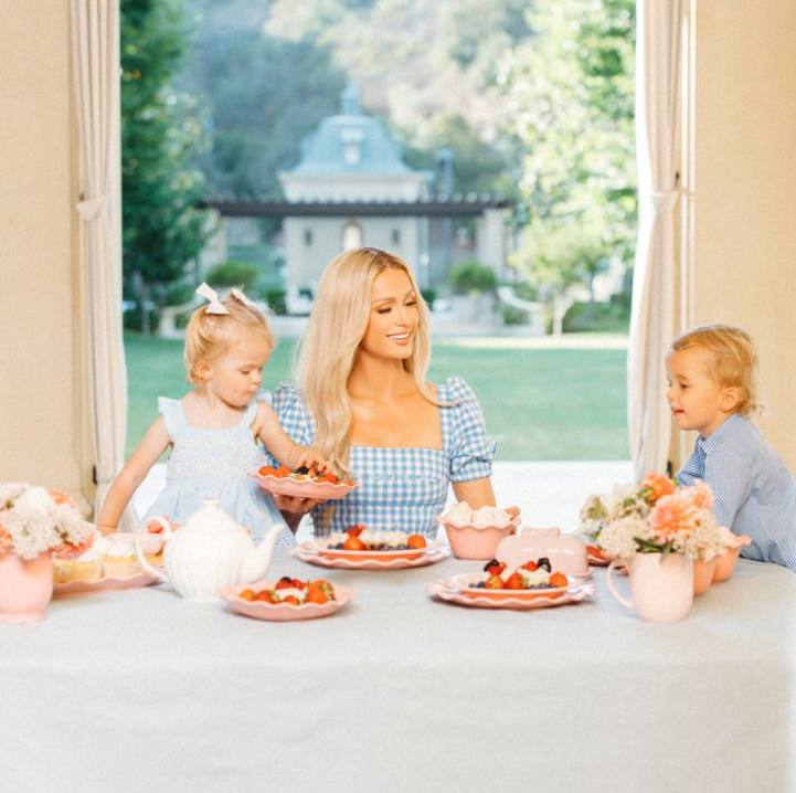 Paris Hilton London Collection 12-Piece Stoneware Dinnerware Set, Plates & Bowls Dish Set, Service for 4, Microwave & Dishwasher Safe, Blush Pink with Bow Design